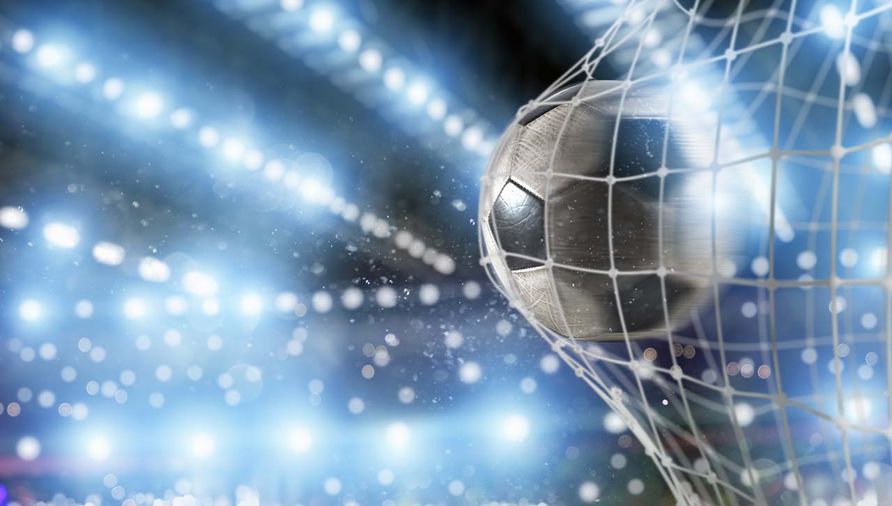 A football in the back of a net