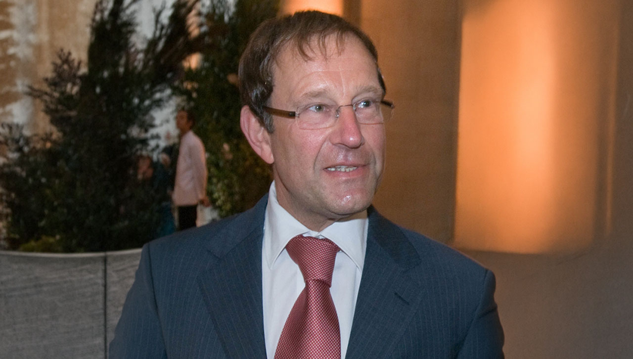 A headshot of Richard Desmond looking displeased