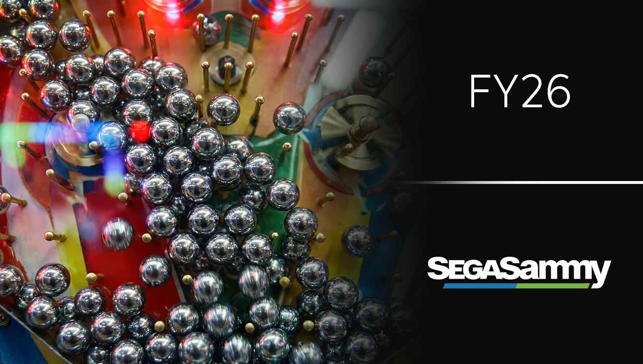 A pachinko machine in the background, with "FY26" and "SegaSammy" on the right